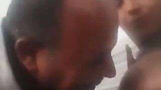 A funny Tunisian couple eating, laughing and kissing