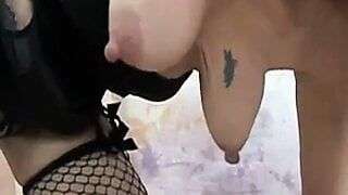 Mature with saggy tits showing her very huge nipples