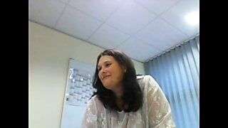 Webcam secretary flashes her heavy hangers in the office