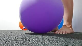 Women Stomping on balloons to pop them